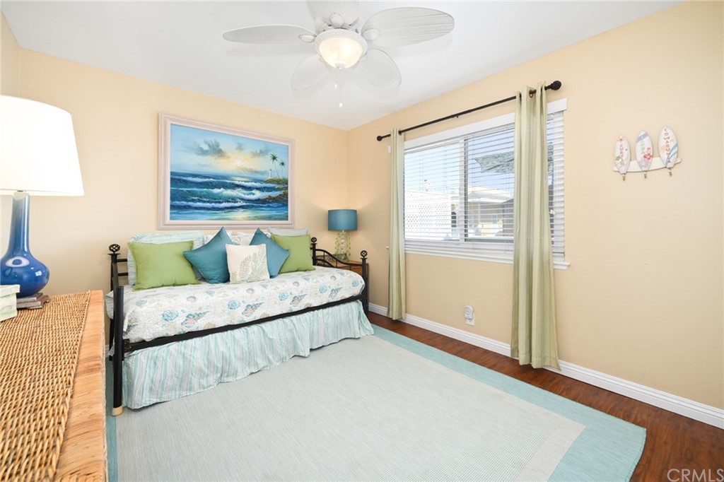 5100 Seashore Drive Newport Beach, CA 92663 - Photo 27 of 67 a living room with furniture and a window