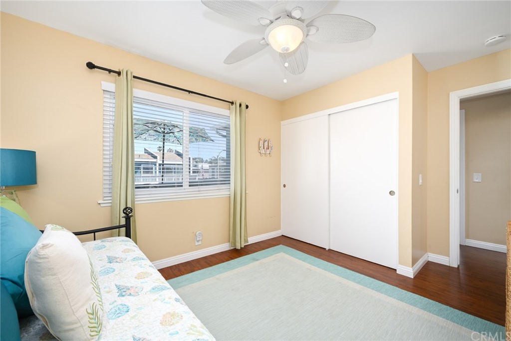 5100 Seashore Drive Newport Beach, CA 92663 - Photo 29 of 67 a view of a bedroom with wooden floor and front door