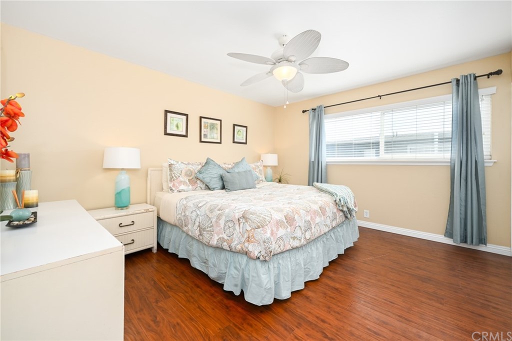 5100 Seashore Drive Newport Beach, CA 92663 - Photo 46 of 67 a bedroom with a large bed and a window