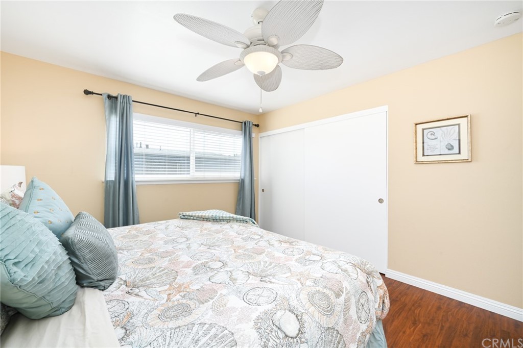 5100 Seashore Drive Newport Beach, CA 92663 - Photo 49 of 67 a bedroom with a large bed and a window