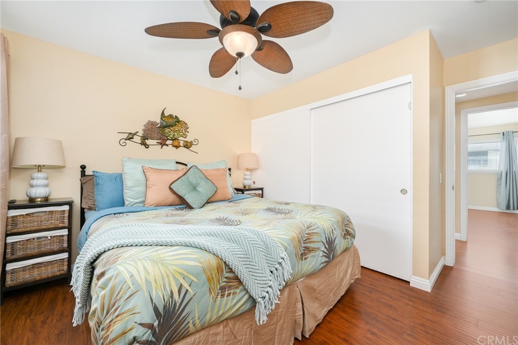 5100 Seashore Drive Newport Beach, CA 92663 - Photo 53 of 67 a bedroom with a bed and wooden floor