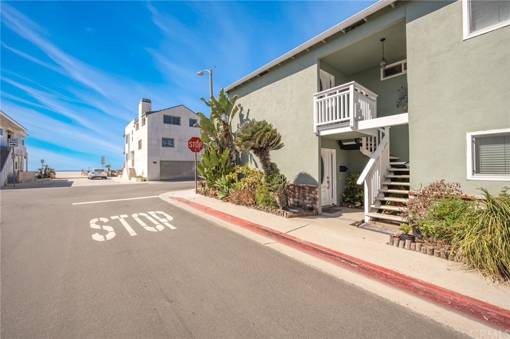 5100 Seashore Drive Newport Beach, CA 92663 - Photo 57 of 67 a front view of a house with a tree