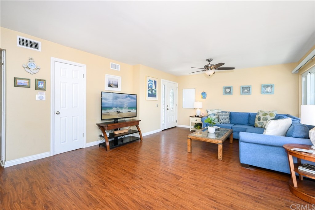 5100 Seashore Drive Newport Beach, CA 92663 - Photo 6 of 67 a living room with furniture and a wooden floor