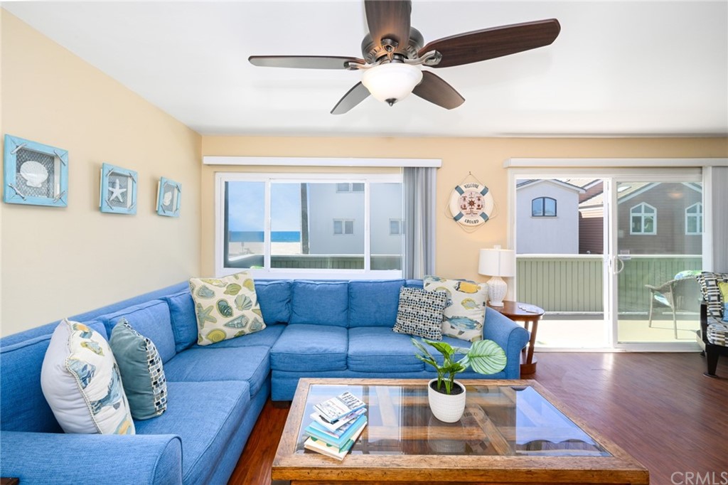 5100 Seashore Drive Newport Beach, CA 92663 - Photo 7 of 67 a living room with furniture rug and wooden floor