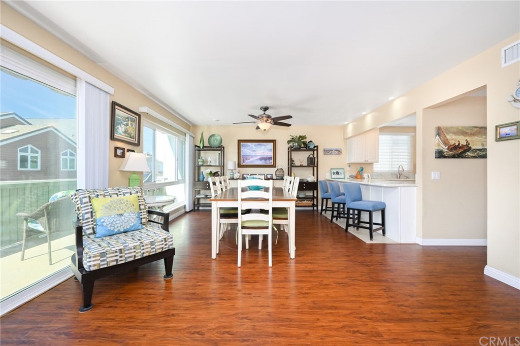 5100 Seashore Drive Newport Beach, CA 92663 - Photo 9 of 67 a living room with furniture wooden floor and a large window