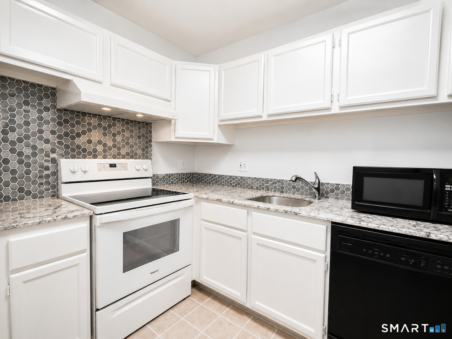 914 High Path Road, Unit 914 Windsor, CT 06095 - Photo 4 of 23 a kitchen with granite countertop white cabinets and white appliances