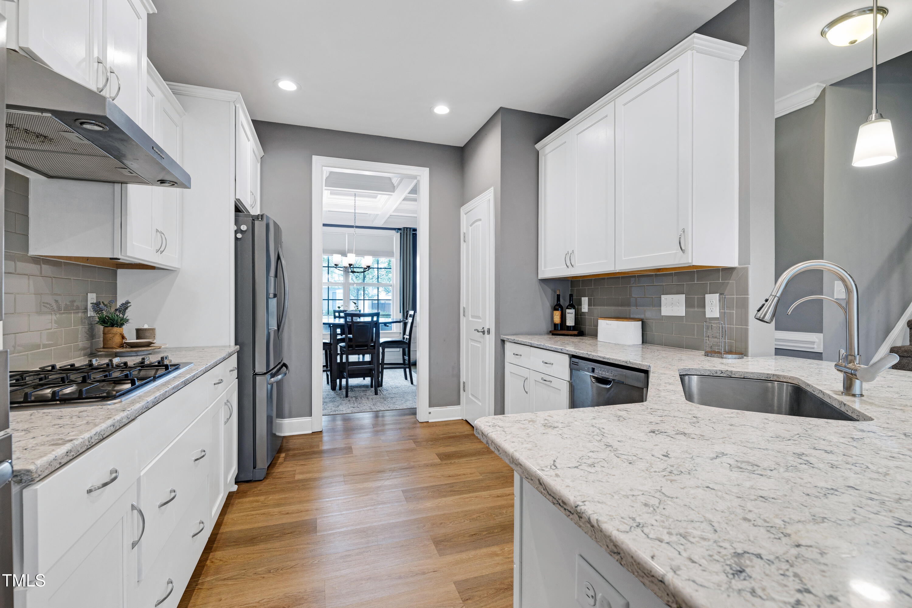 1417 Slate Ridge Road Knightdale, NC 27545 - Photo 13 of 66 a kitchen with stainless steel appliances granite countertop a sink stove and refrigerator