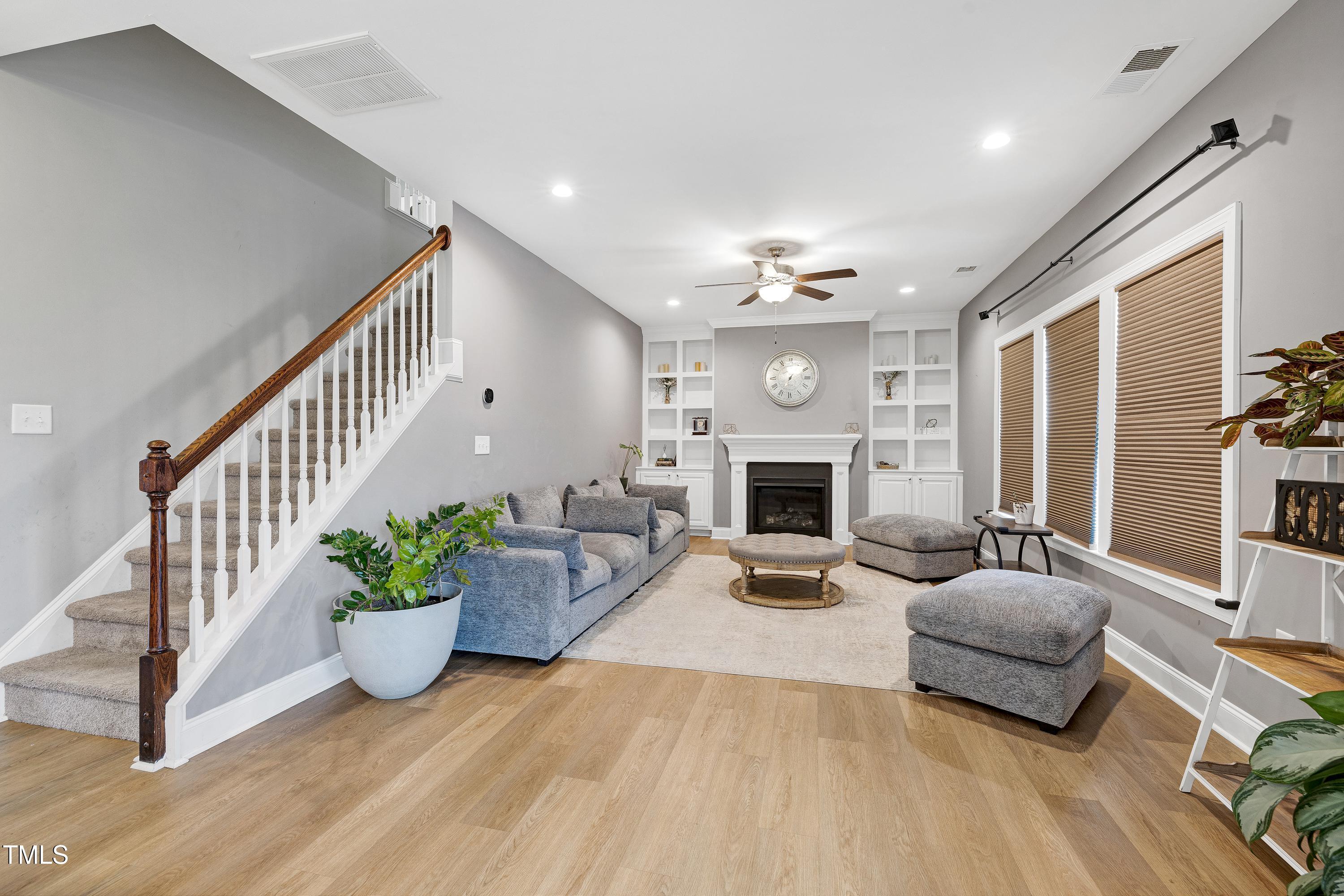1417 Slate Ridge Road Knightdale, NC 27545 - Photo 16 of 66 a living room with furniture and a fireplace
