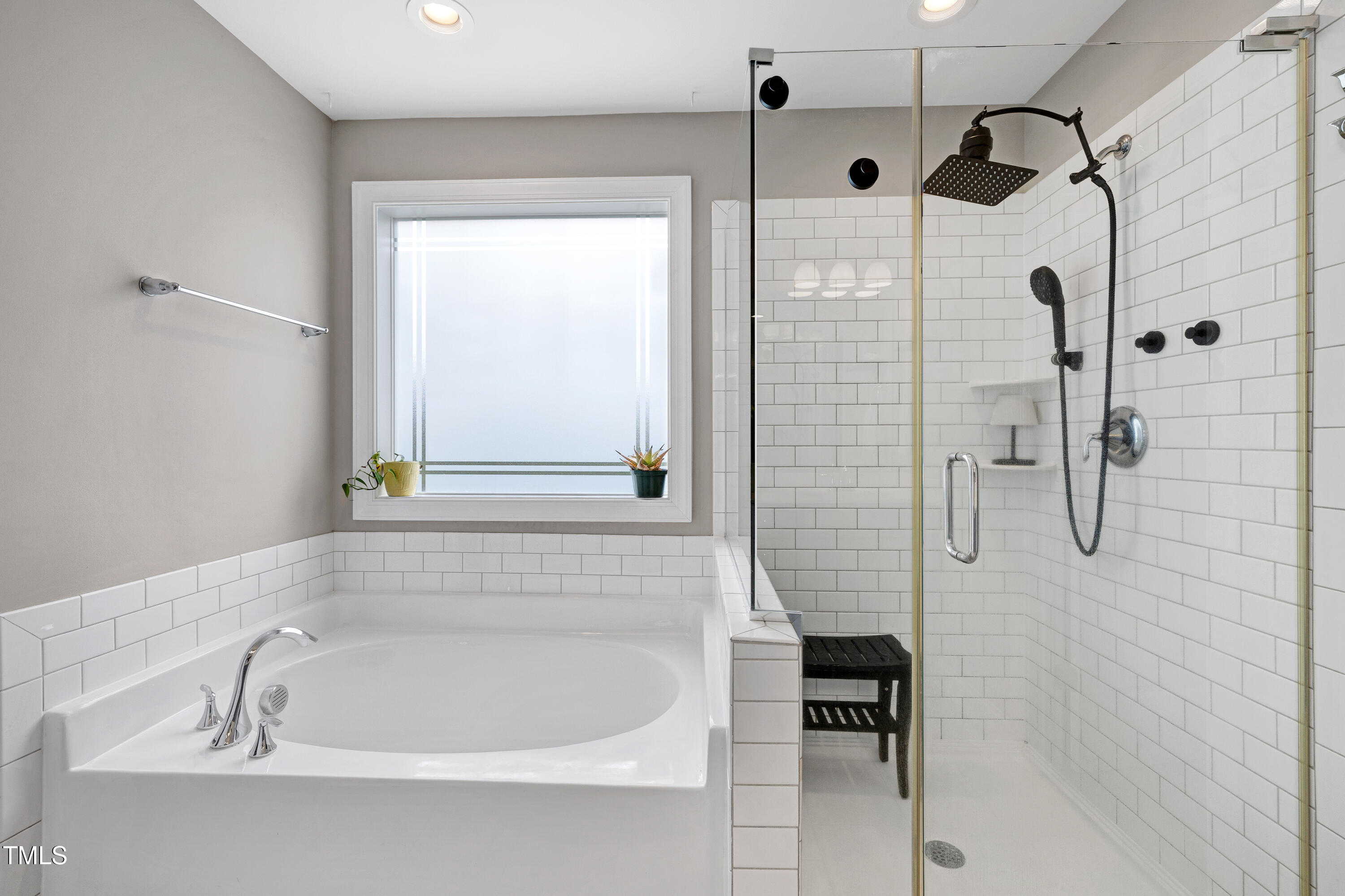 1417 Slate Ridge Road Knightdale, NC 27545 - Photo 26 of 66 a bathroom with a bathtub and a shower
