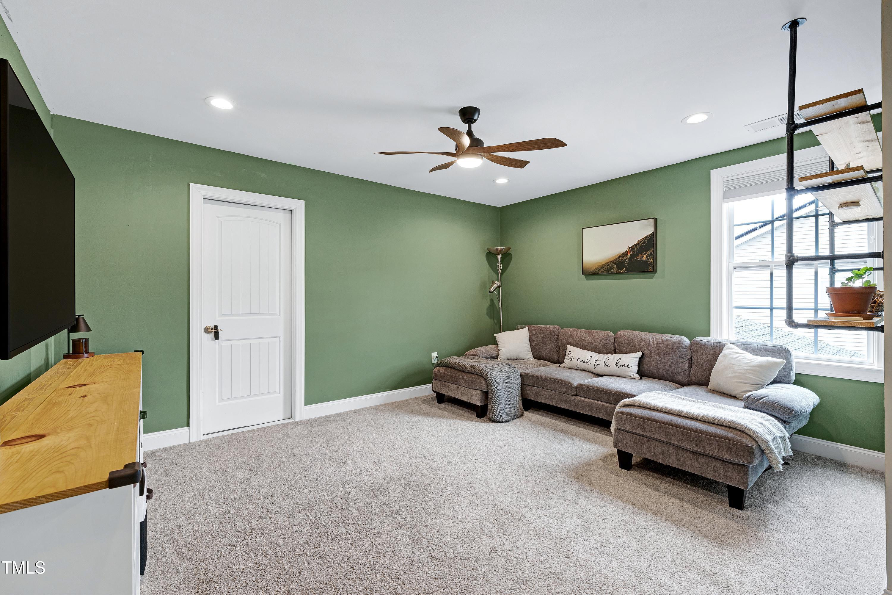 1417 Slate Ridge Road Knightdale, NC 27545 - Photo 31 of 66 a living room with furniture and a window