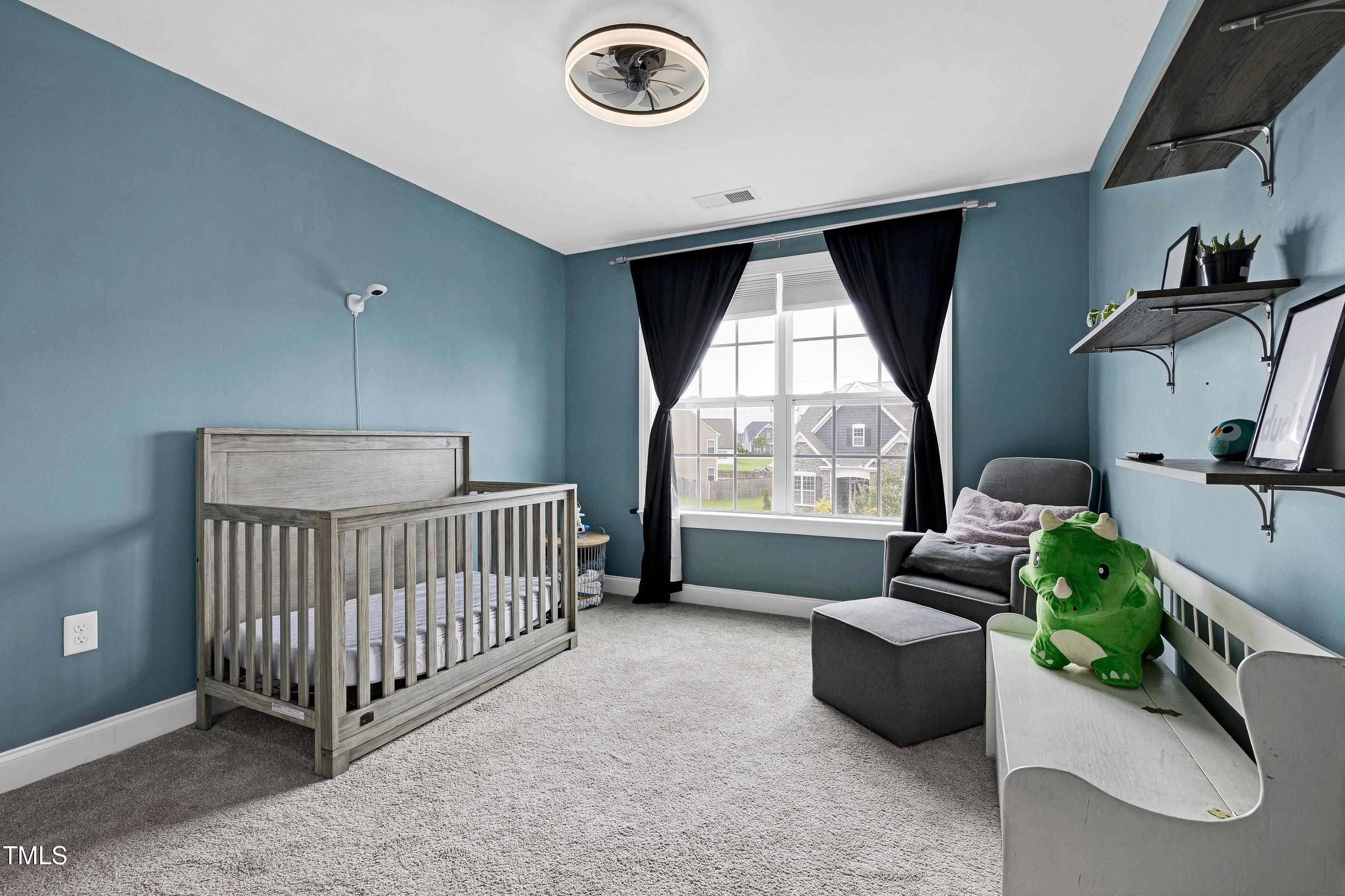 1417 Slate Ridge Road Knightdale, NC 27545 - Photo 34 of 66 a bed room with a bed and a window