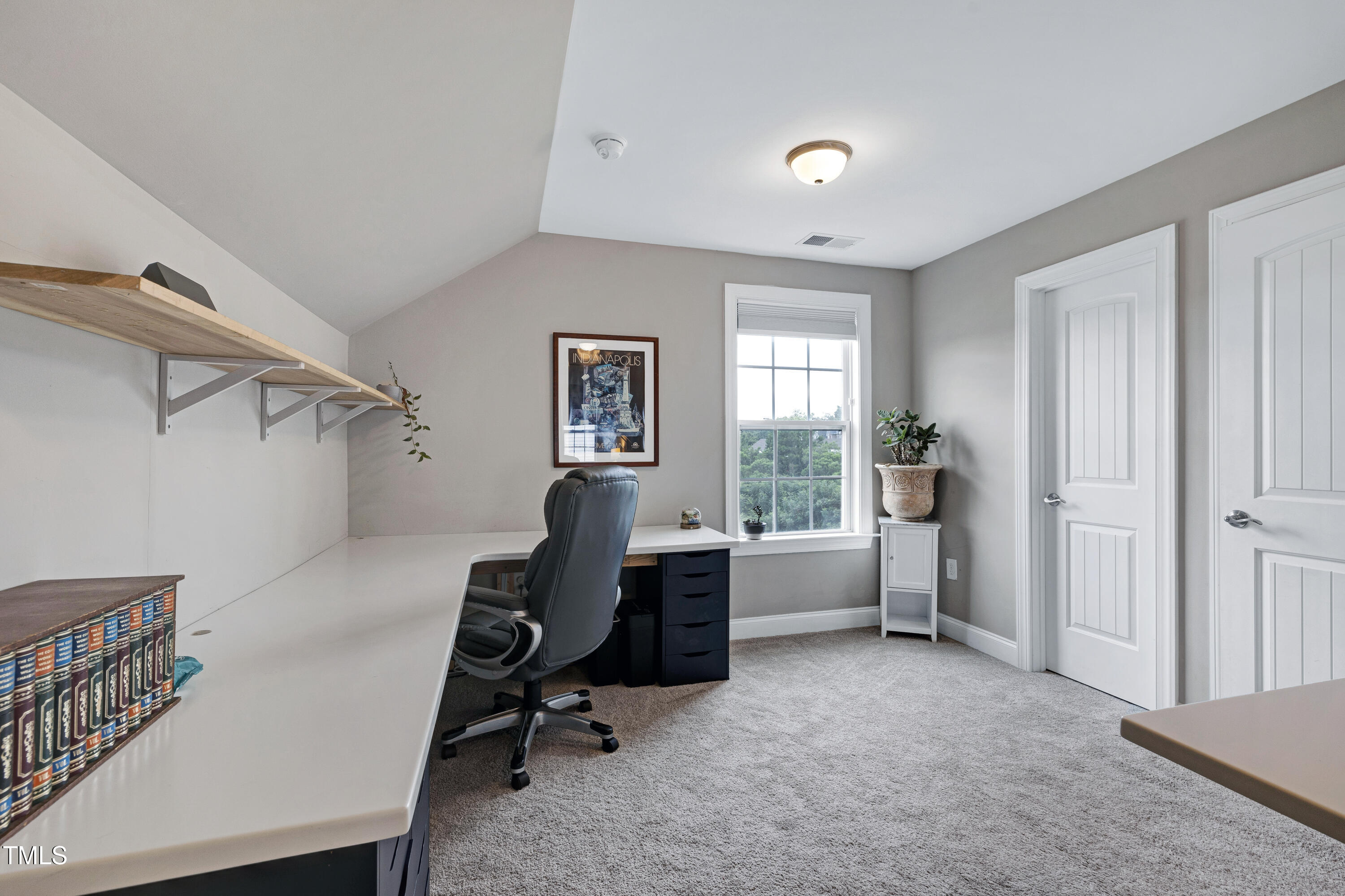 1417 Slate Ridge Road Knightdale, NC 27545 - Photo 37 of 66 a view of a workspace with furniture and a window