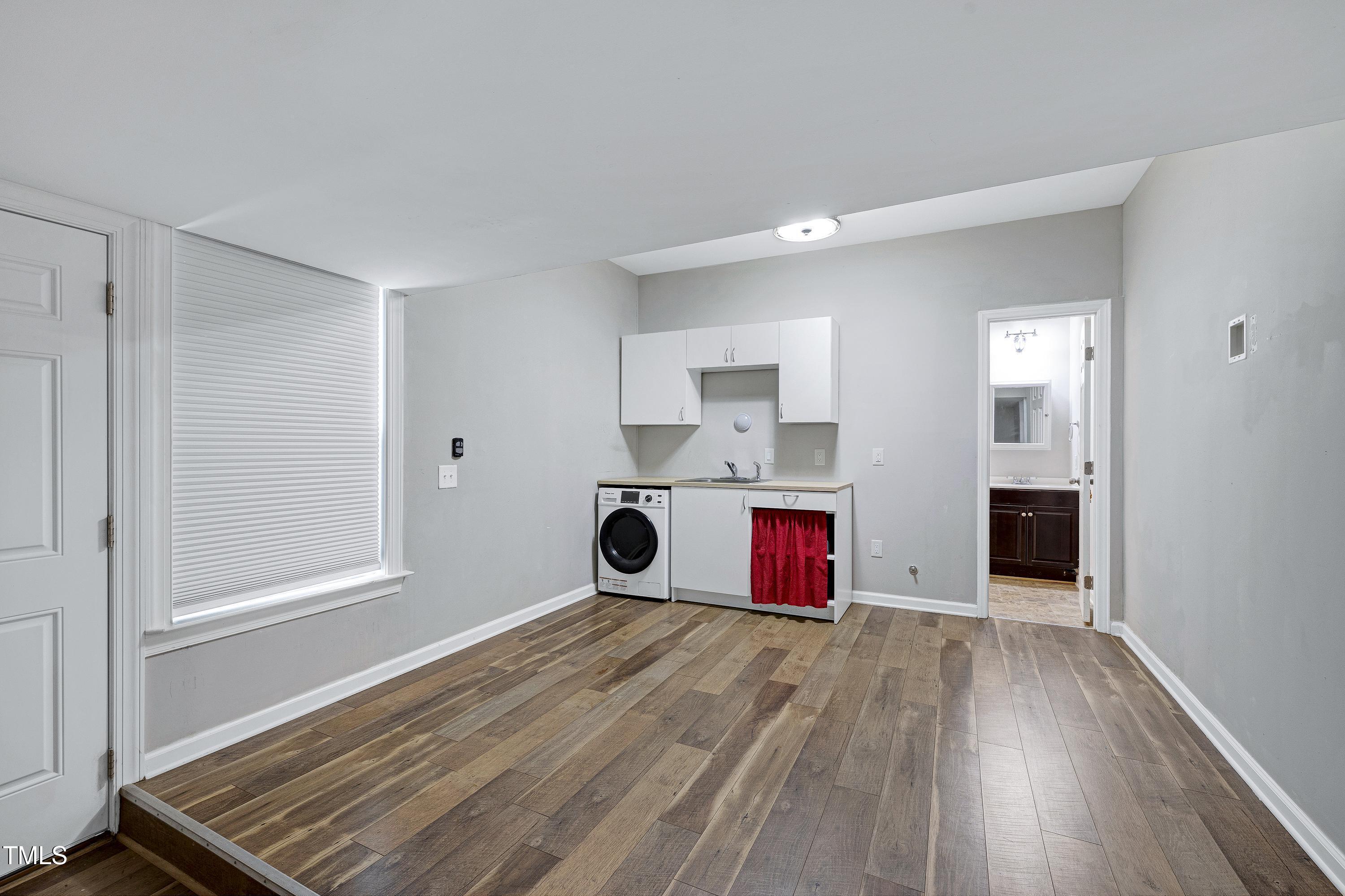 1417 Slate Ridge Road Knightdale, NC 27545 - Photo 45 of 66 a view of kitchen and wooden floor