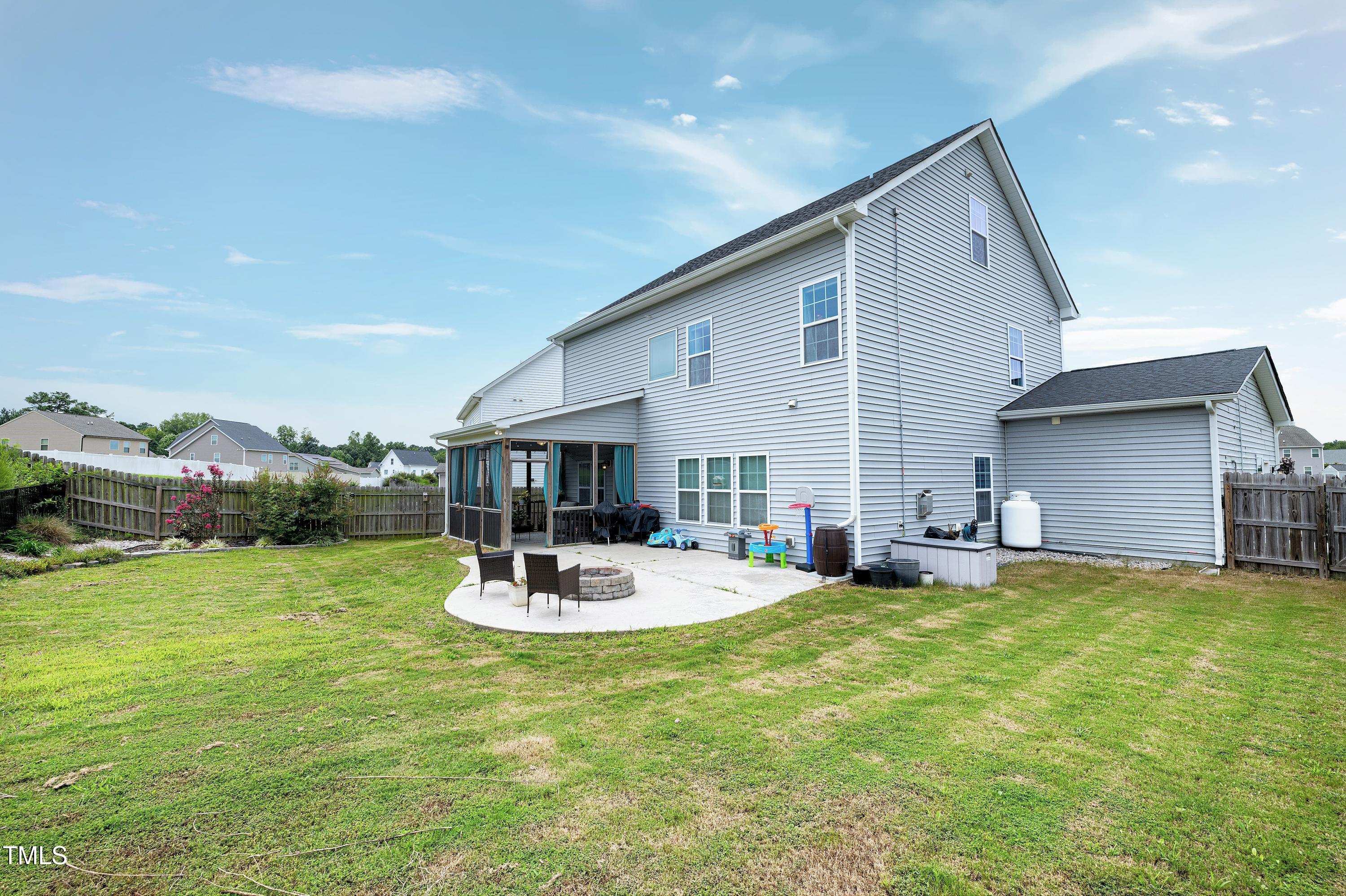 1417 Slate Ridge Road Knightdale, NC 27545 - Photo 50 of 66 a view of a house with backyard and sitting area