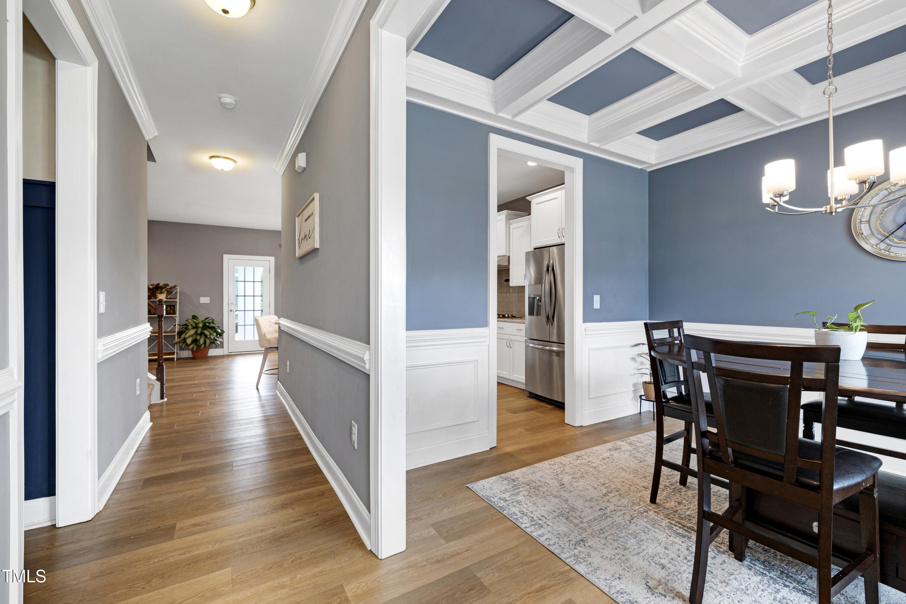 1417 Slate Ridge Road Knightdale, NC 27545 - Photo 6 of 66 a view of a hallway with wooden floor a chandelier