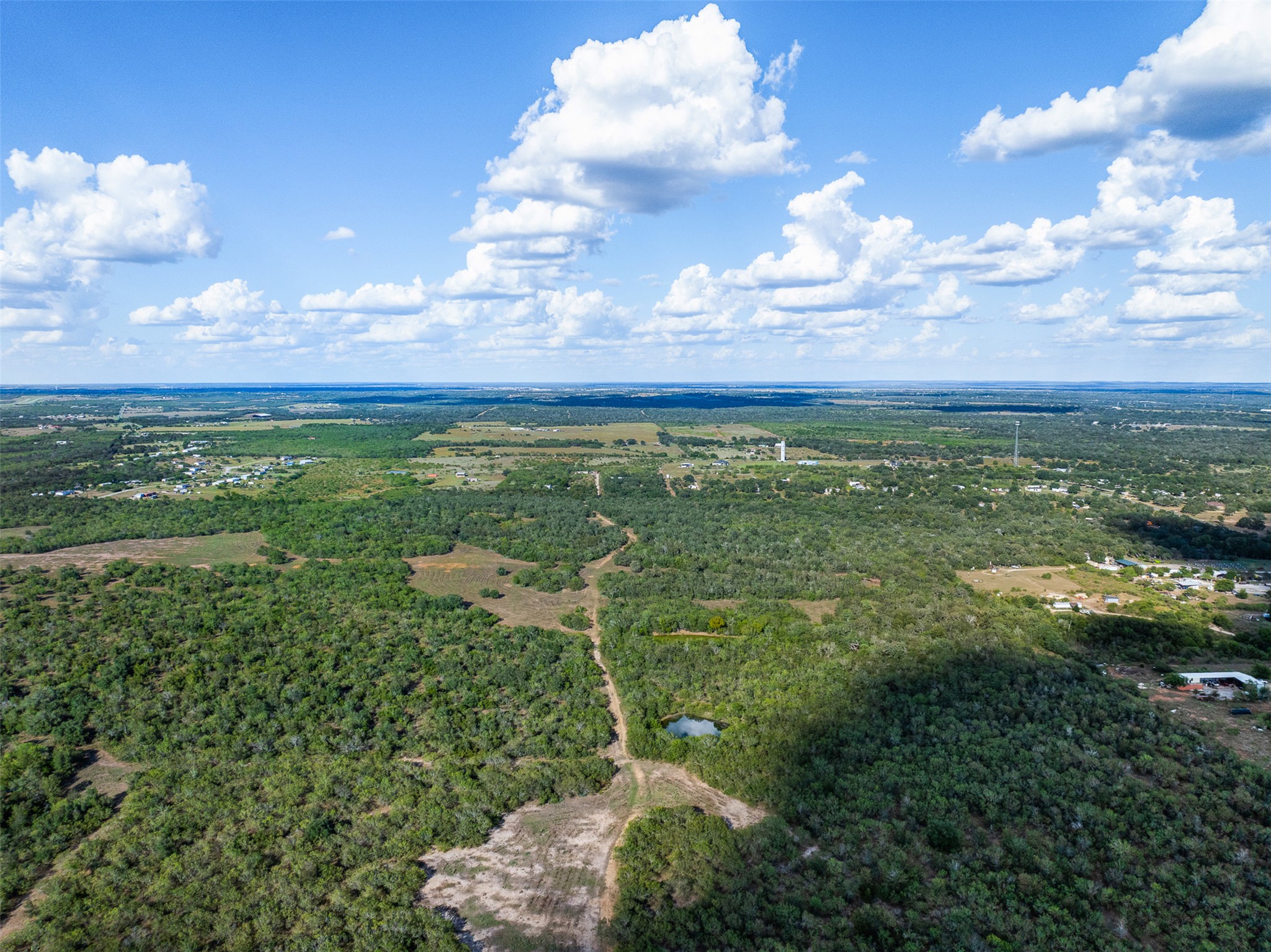 399 Seals Creek Road Lockhart, TX 78644 - Photo 13 of 40 Drone / aerial view of a heavily wooded area