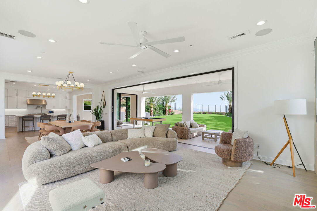 20448 Liverpool Way Porter Ranch, CA 91326 - Photo 12 of 61 a living room with furniture and a large window