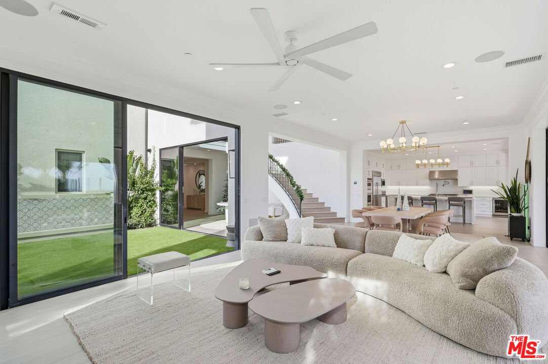 20448 Liverpool Way Porter Ranch, CA 91326 - Photo 13 of 61 a living room with furniture and a large window