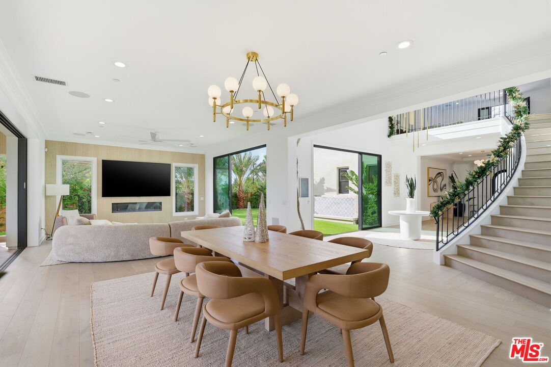 20448 Liverpool Way Porter Ranch, CA 91326 - Photo 23 of 61 a view of a dining room with furniture window and wooden floor