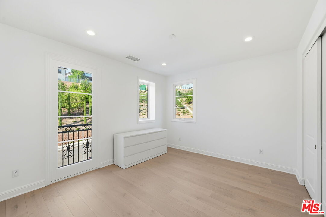 20448 Liverpool Way Porter Ranch, CA 91326 - Photo 33 of 61 an empty room with windows