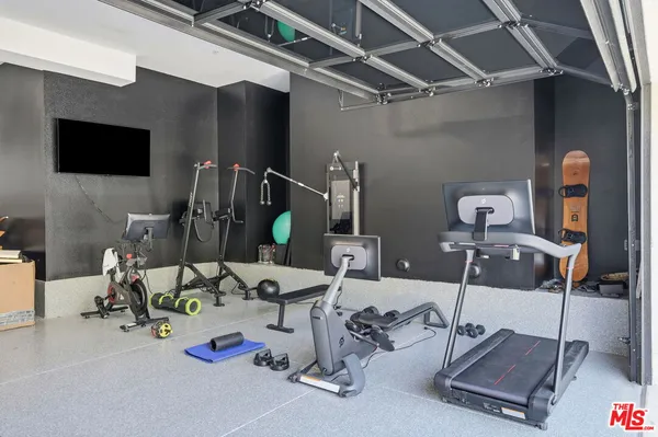 a living room with couch and a large window