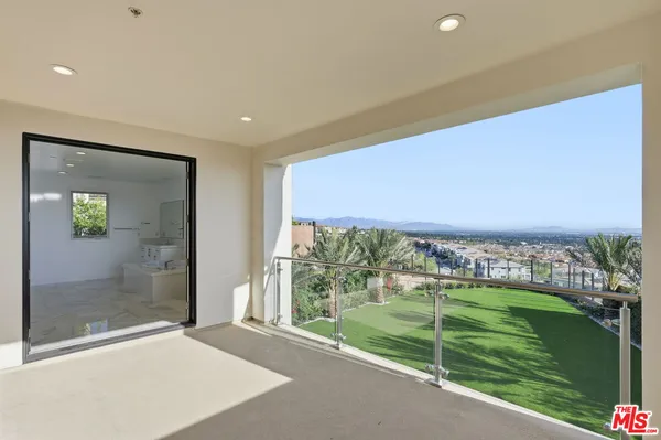 a view of a chairs in backyard of the house