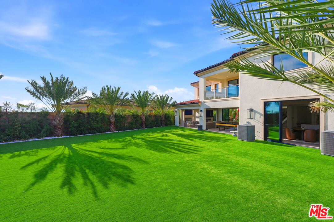 20448 Liverpool Way Porter Ranch, CA 91326 - Photo 56 of 61 a front view of a house with yard and green space