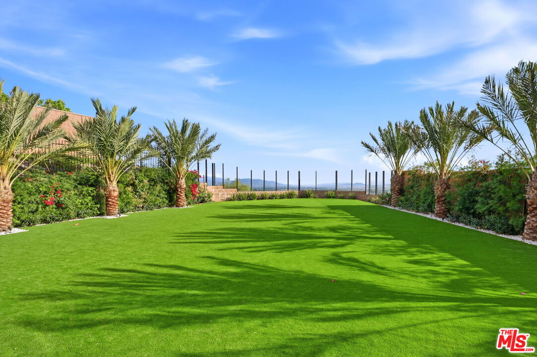 20448 Liverpool Way Porter Ranch, CA 91326 - Photo 57 of 61 a view of a big yard with a palm trees