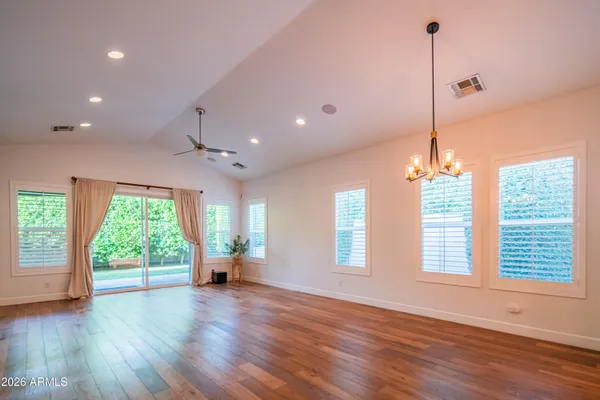 a kitchen with a sink a stove and a wooden floors