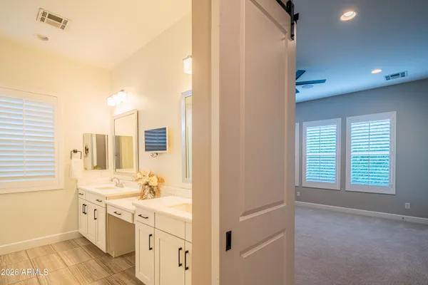 a bathroom with a glass shower door