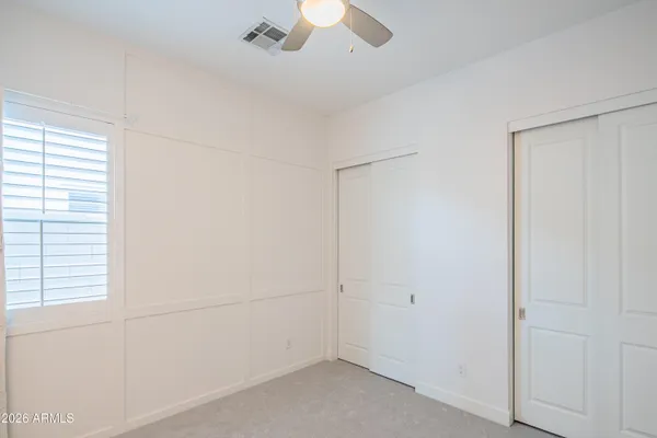 a view of a kitchen with dining room and wooden floor