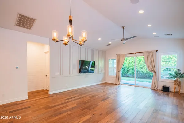 a view of a balcony with wooden floor