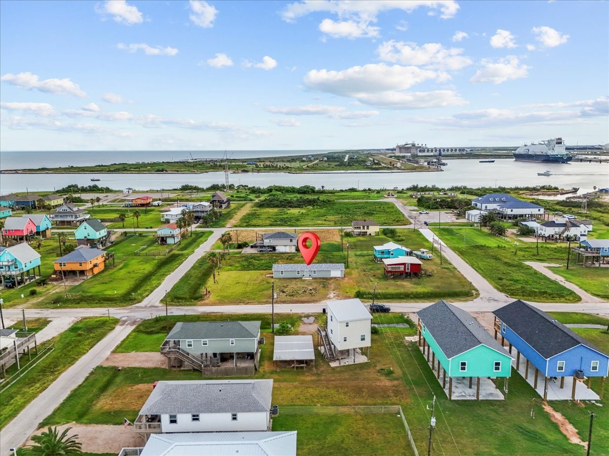 515 Thunder Road Surfside Beach, TX 77541 - Photo 28 of 31 Charming coastal neighborhood with colorful homes, close to water with scenic views. Quiet streets and nearby access to amenities and a shipping channel, ideal for relaxed living.