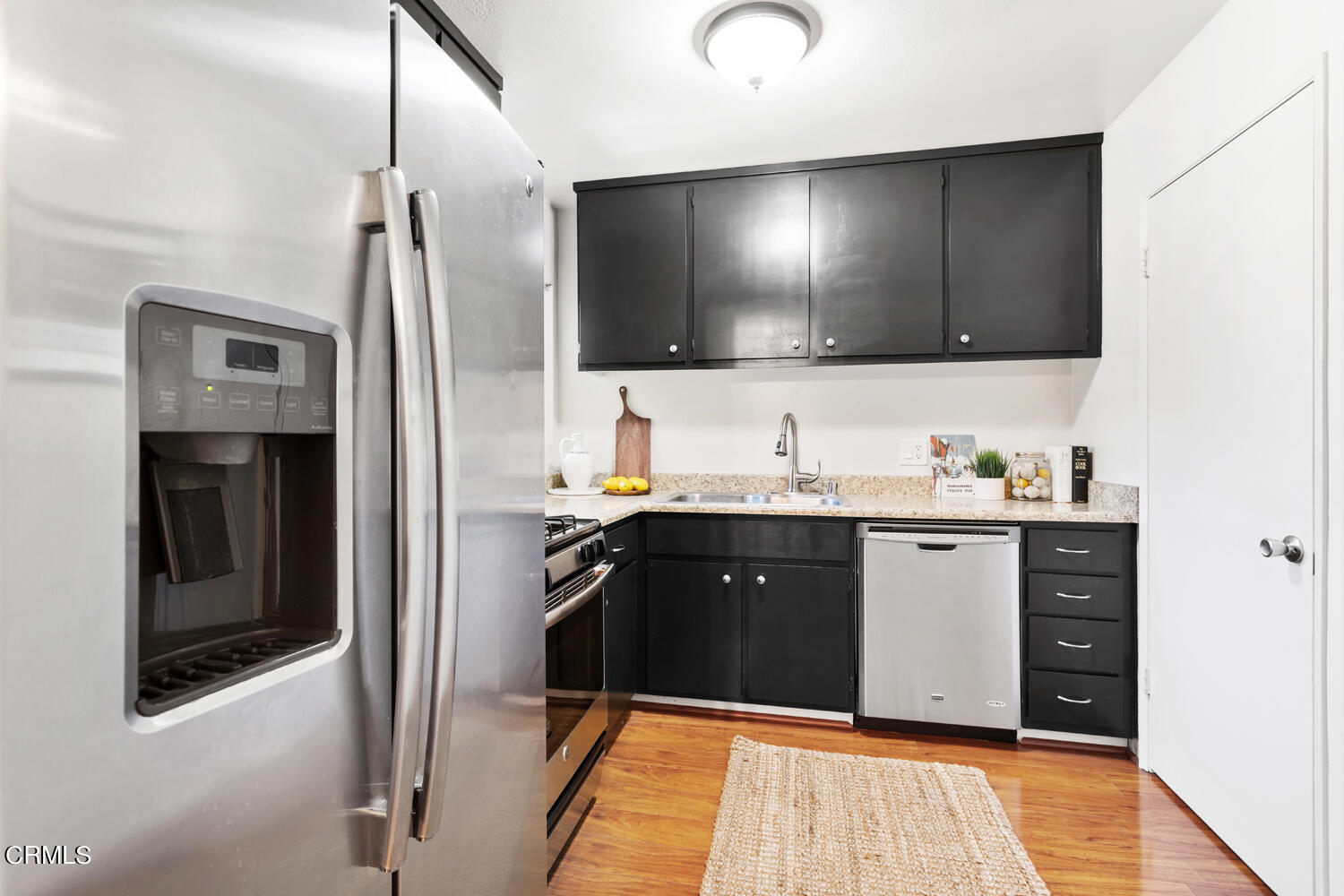 4828 Hollow Corner Road, Unit 293 Culver City, CA 90230 - Photo 11 of 24 a spacious bathroom with a granite countertop sink and a mirror