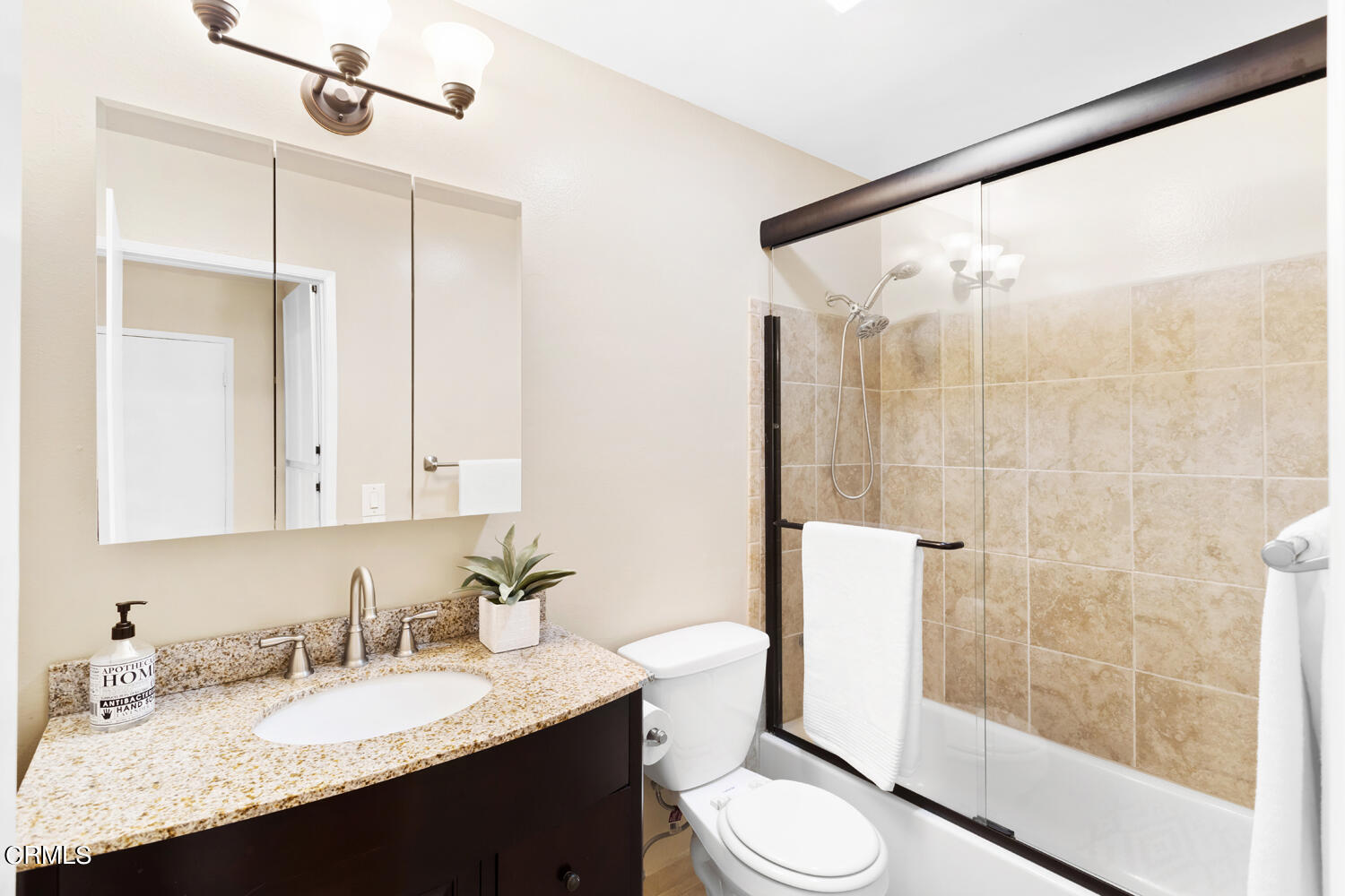 4828 Hollow Corner Road, Unit 293 Culver City, CA 90230 - Photo 14 of 24 a bathroom with a granite countertop sink toilet and shower