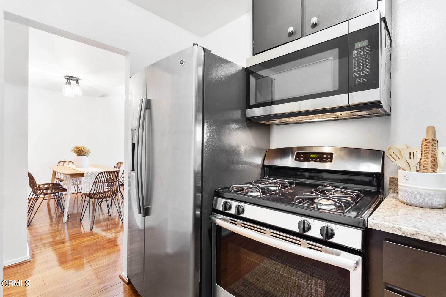 4828 Hollow Corner Road, Unit 293 Culver City, CA 90230 - Photo 7 of 24 a kitchen with stainless steel appliances granite countertop a stove a refrigerator and a microwave