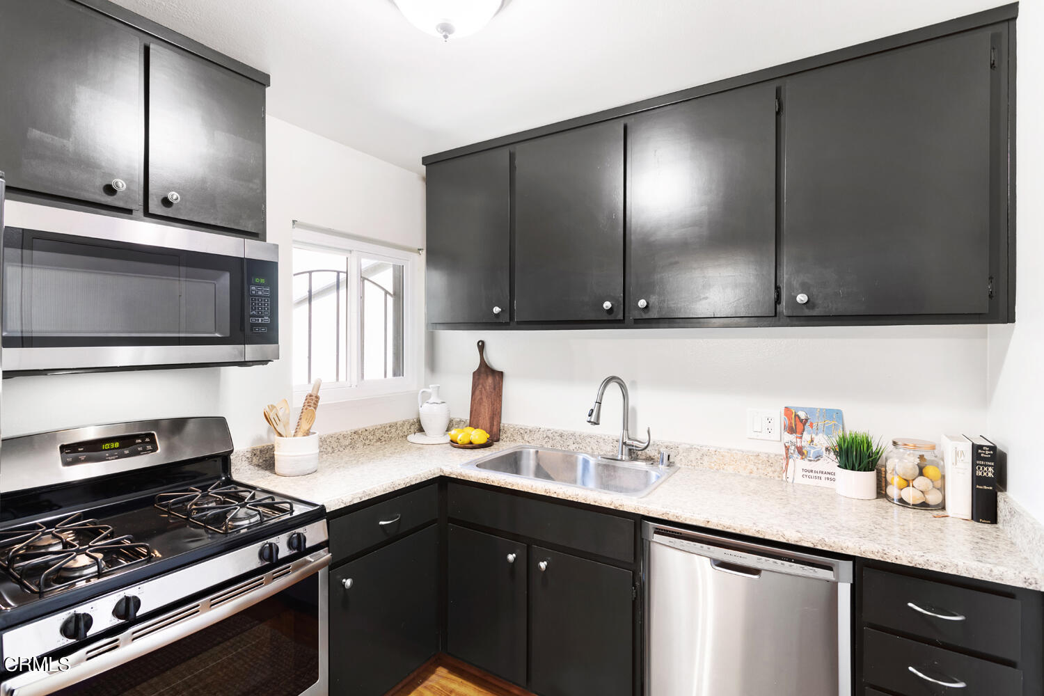 4828 Hollow Corner Road, Unit 293 Culver City, CA 90230 - Photo 9 of 24 a kitchen with sink a microwave and cabinets