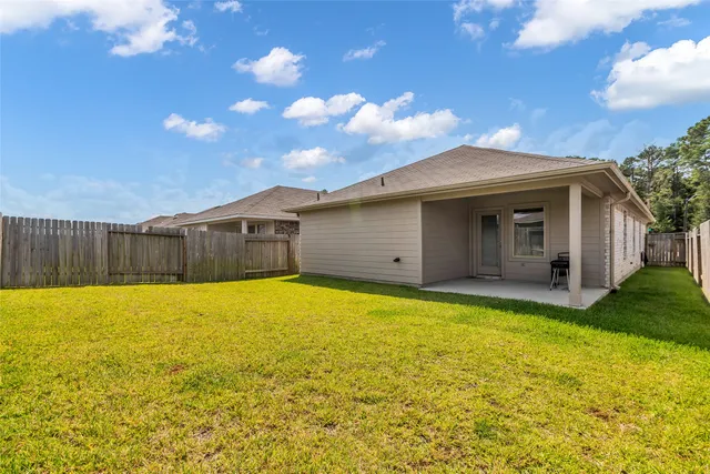 a view of a swimming pool with an outdoor space and seating area