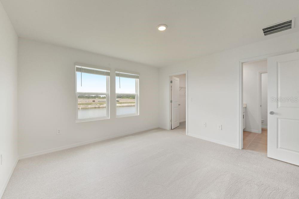 13235 Commons Avenue Parrish, FL 34219 - Photo 14 of 37 an empty room with windows and closet