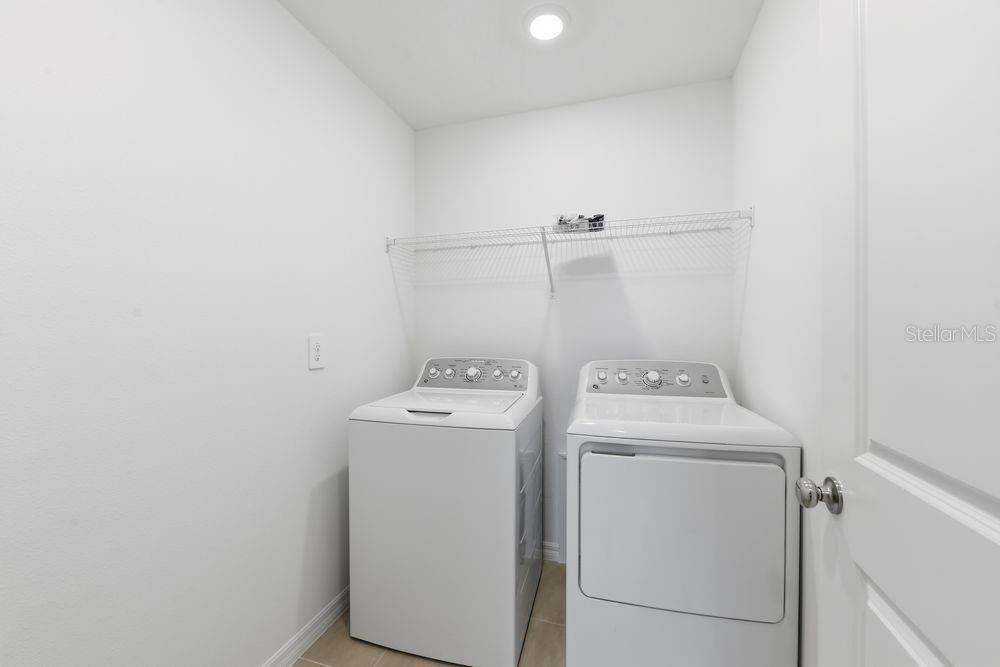13235 Commons Avenue Parrish, FL 34219 - Photo 28 of 37 a utility room with dryer and washer