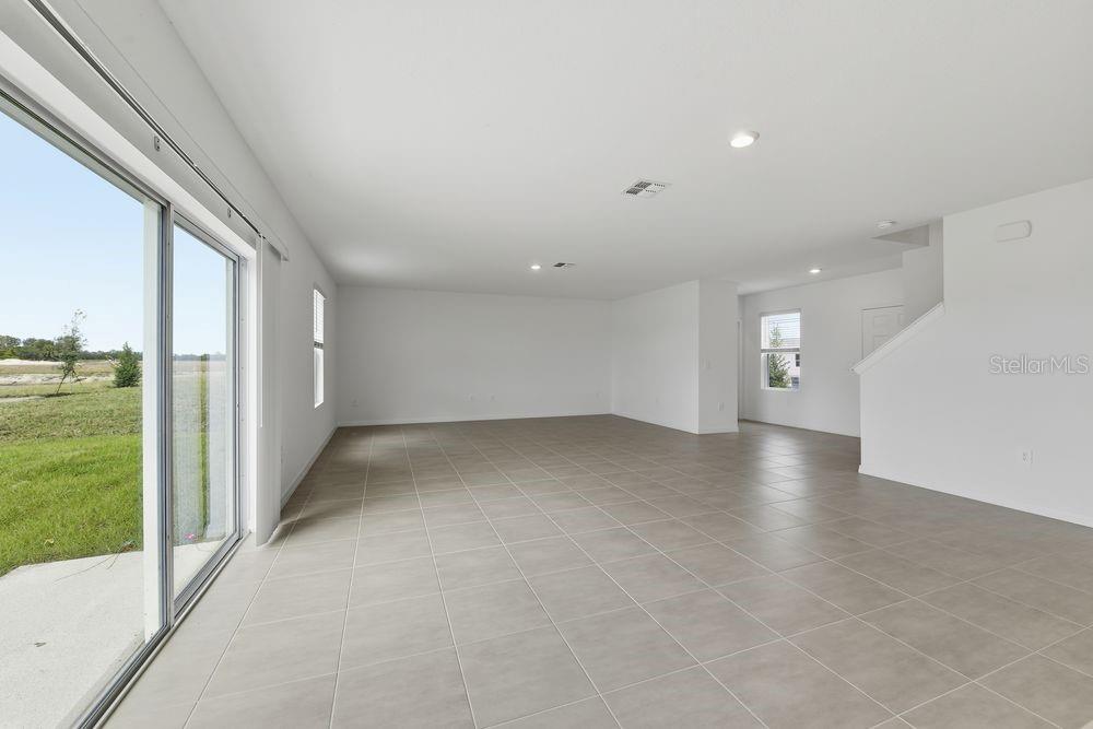 13235 Commons Avenue Parrish, FL 34219 - Photo 6 of 37 a view of a livingroom with a staircase