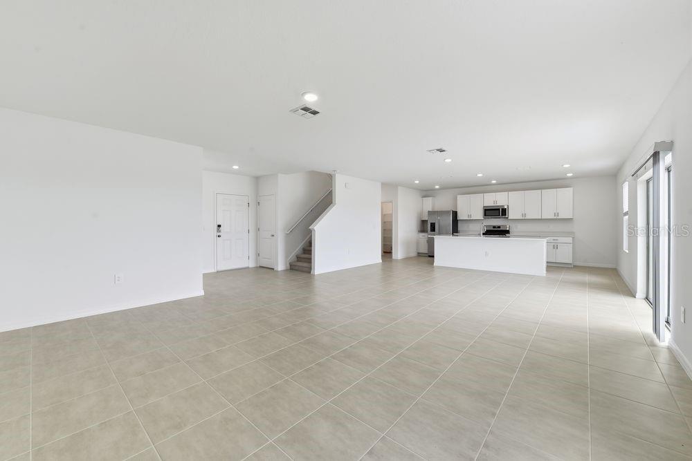 13235 Commons Avenue Parrish, FL 34219 - Photo 9 of 37 a view of a kitchen with a sink and a refrigerator