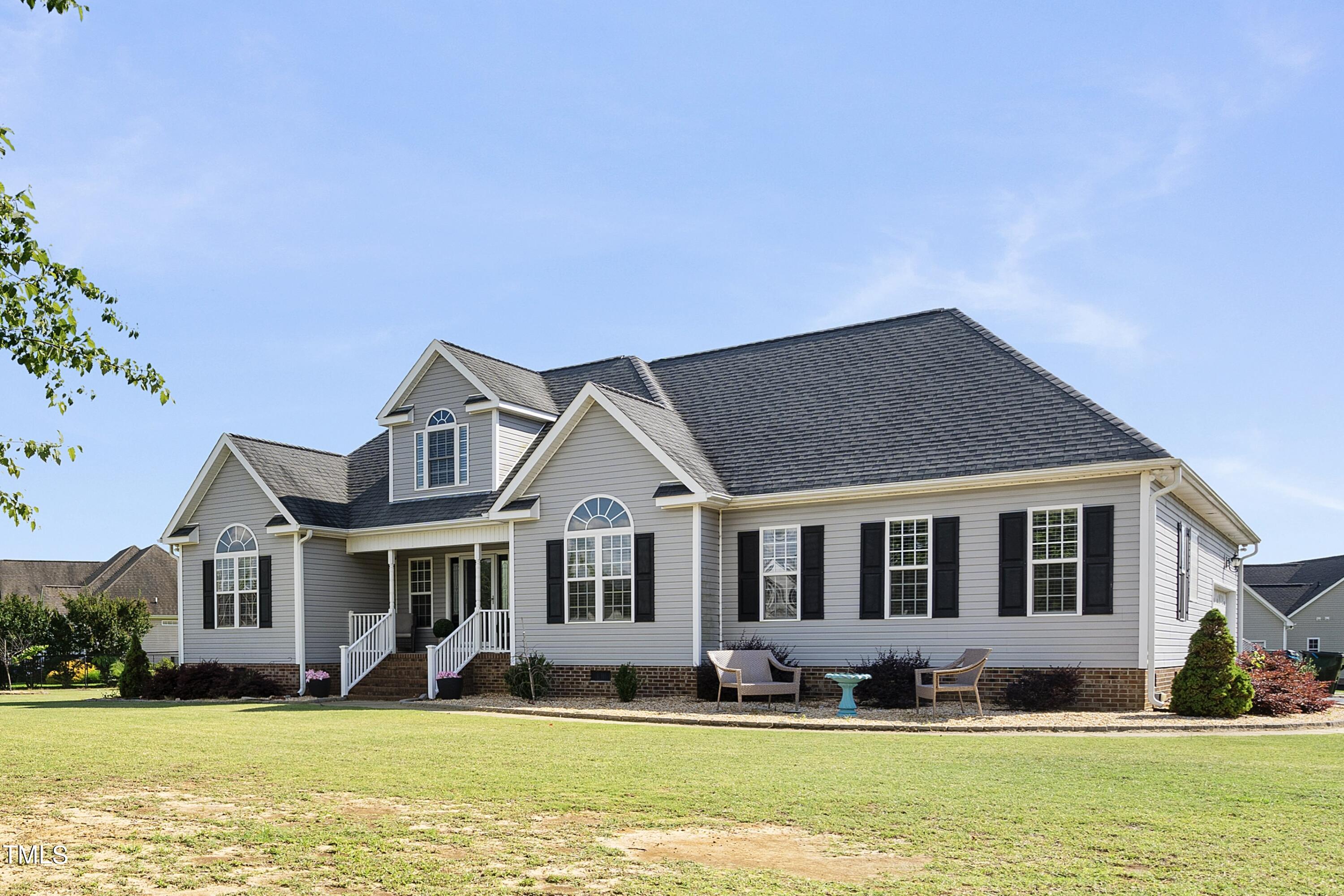 6910 Rock Ridge Sims Road Sims, NC 27880 - Photo 1 of 45 a front view of a house with a yard