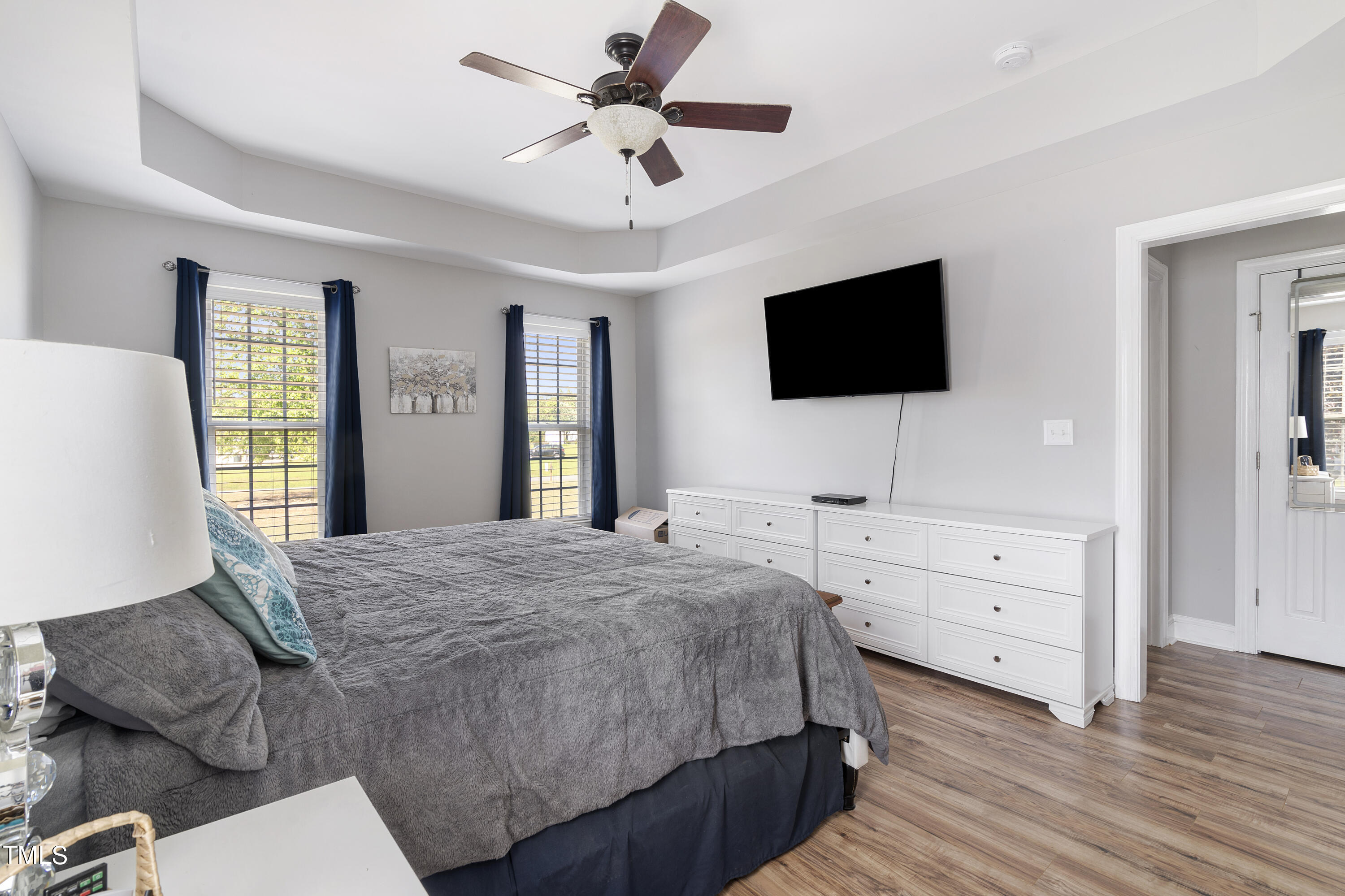 6910 Rock Ridge Sims Road Sims, NC 27880 - Photo 18 of 45 a bedroom with a bed and a flat screen tv