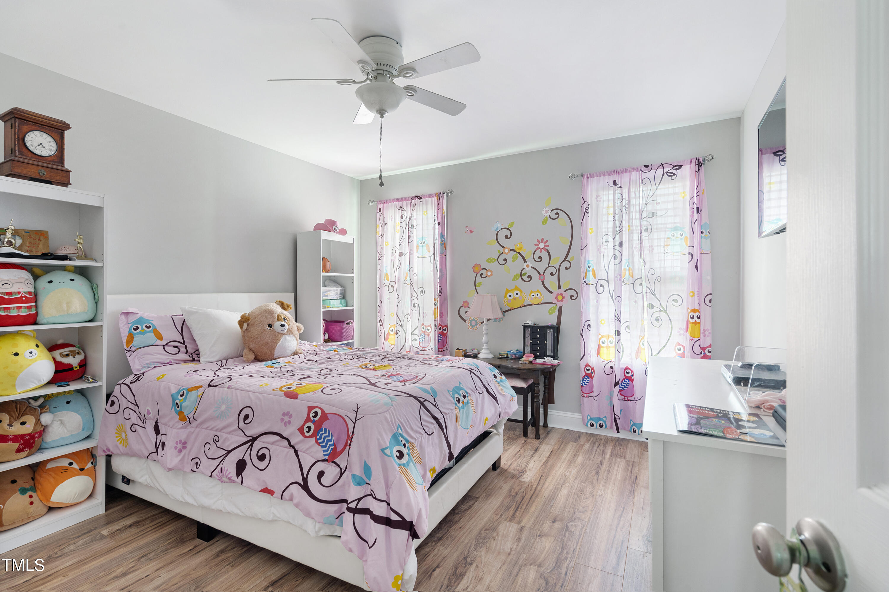 6910 Rock Ridge Sims Road Sims, NC 27880 - Photo 23 of 45 a bedroom with a bed and a chandelier
