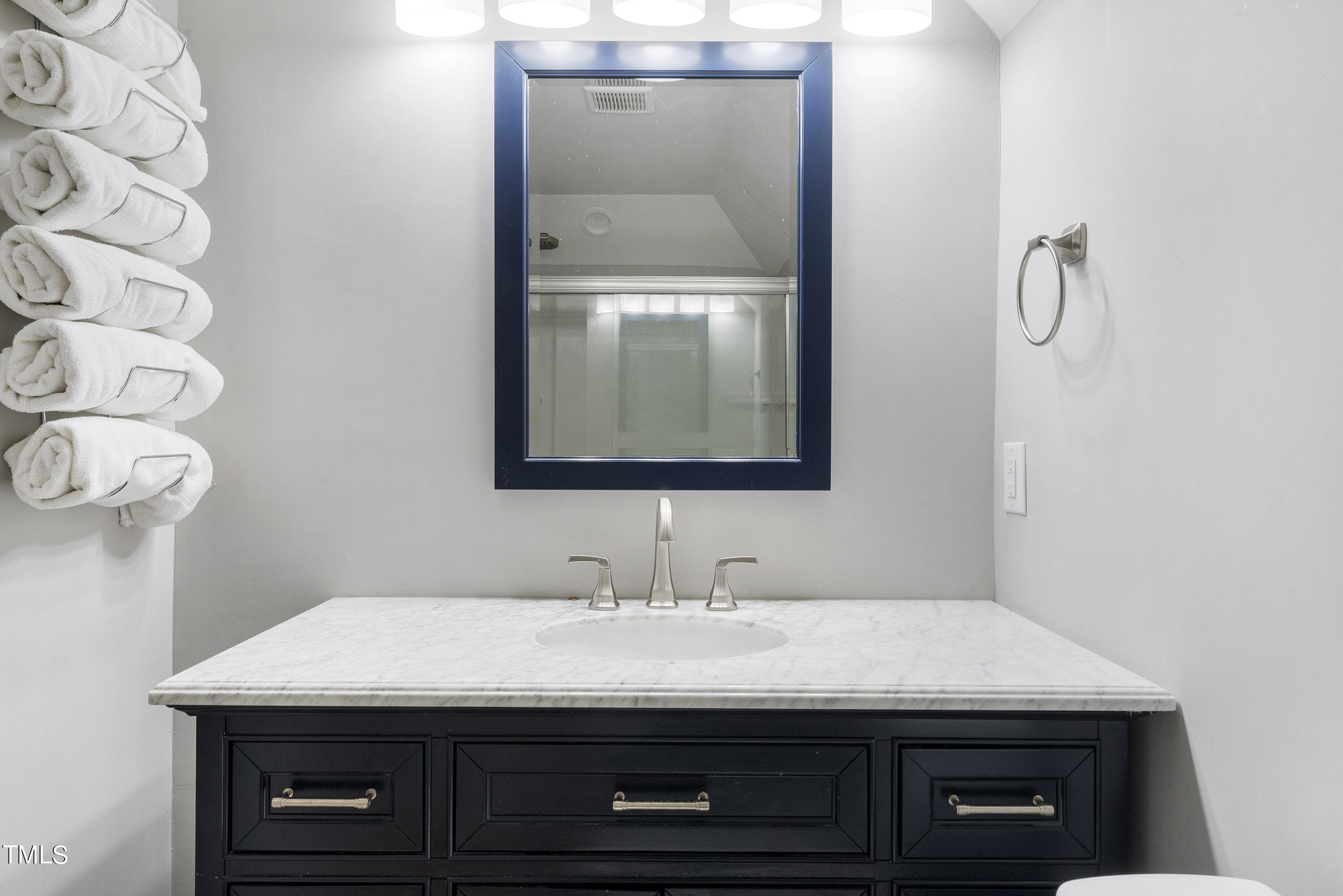 6910 Rock Ridge Sims Road Sims, NC 27880 - Photo 31 of 45 a bathroom with a sink and a mirror