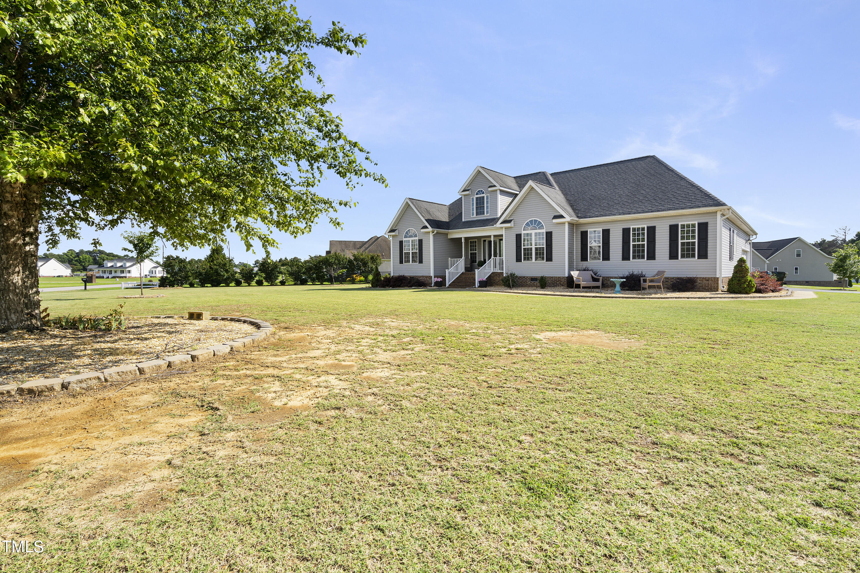 6910 Rock Ridge Sims Road Sims, NC 27880 - Photo 41 of 45 a front view of a house with a yard
