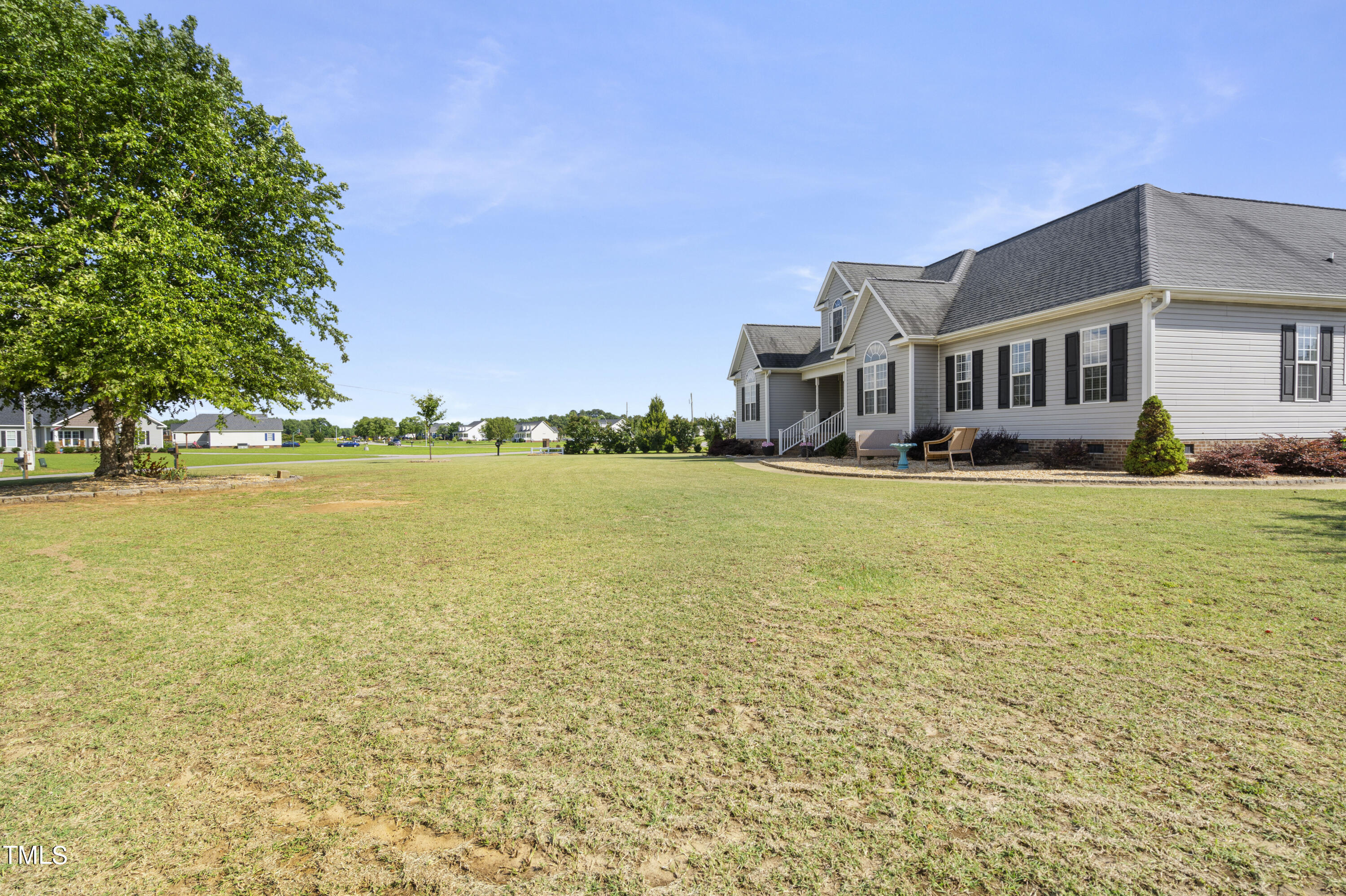 6910 Rock Ridge Sims Road Sims, NC 27880 - Photo 42 of 45 a front view of a building with garden