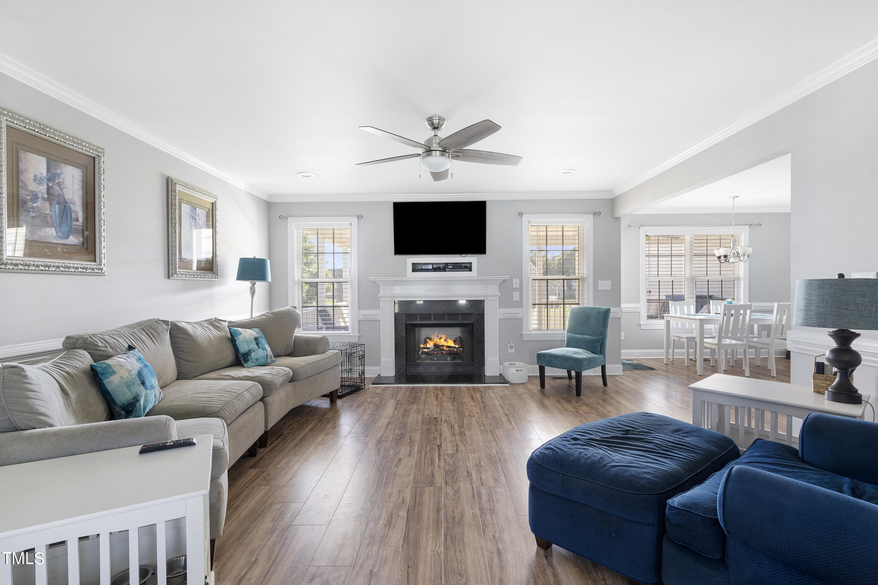 6910 Rock Ridge Sims Road Sims, NC 27880 - Photo 6 of 45 a living room with furniture a fireplace and a flat screen tv
