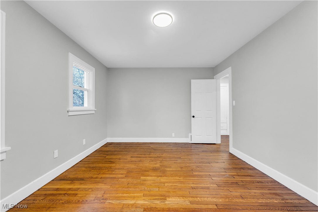 2593 Princeton Road Cleveland, OH 44118 - Photo 25 of 34 Empty room with baseboards and wood finished floors